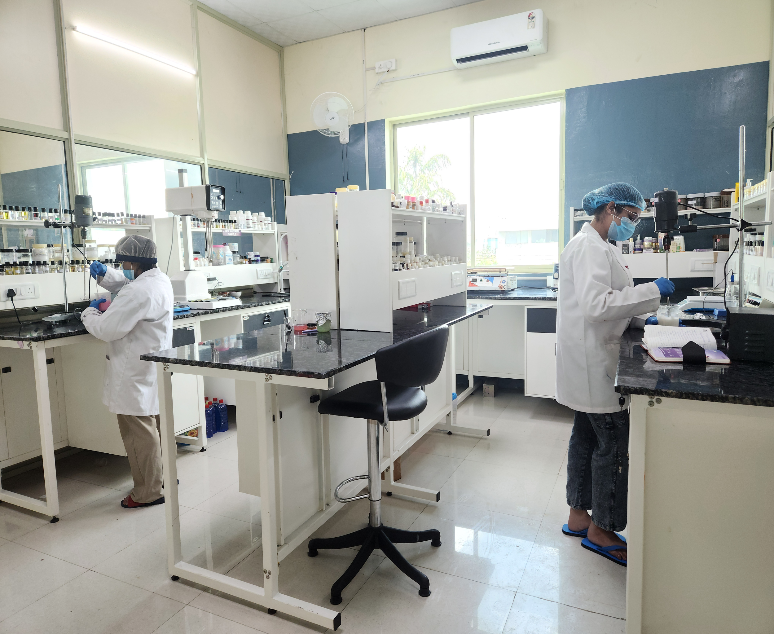 Two chemists working in R&D lab